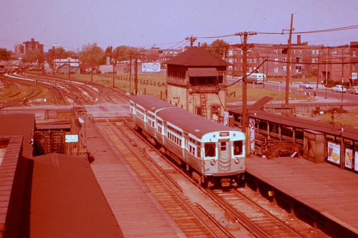 CTA 6037-6038 heading west at Laramie on a CERA fantrip on May 1, 1955, showing how the line curved off a bit to the south, before straightening out temporarily to cross Lockwood before veering off again to run parallel with the B&O. We have attempted to bring the color back as much as possible in this early Ektachrome slide, which has a very pronounced "red shift." (Photo by Ray DeGroote)