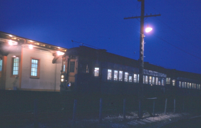 In this nighttime shot, a CA&E train sits at Des Plaines terminal in April 1957. (Photographer unknown)
