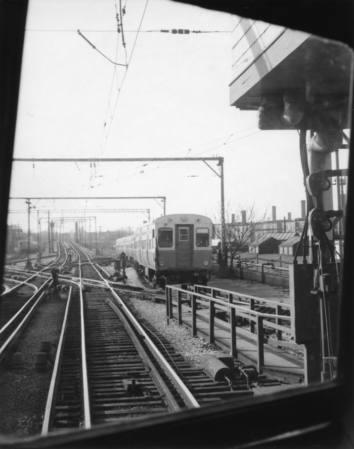 A train of CTA 6000s, as seen from a CNS&M Electroliner, looking north at Howard St., in a photograph by Lawrence H. Boehning, taken on May 8, 1958 (Author's collection).