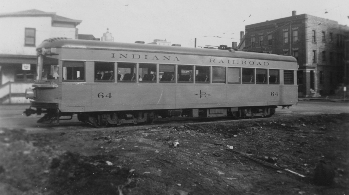 On the back of the photo, it says, "Indiana RR lightweight interurban #64. Snapped in Ft. Wayne, April 1, 1939. Color- orange + green roof. Built 1930 by Am. Car Co., Jeffersonville, Ind." (Author's collection)