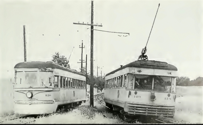 IR #65 at left in CRANDIC service, renumbered as #120, with an ex-CLE high-speed at the right (Author's collection)