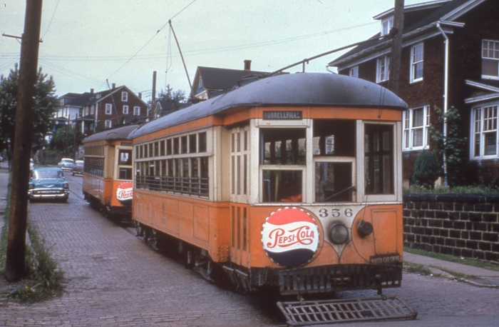 Those aren't drumheads on these 1950s Johnston PA streetcars, just advertising. "Pepsi-Cola hits the spot / Twelve full ounces, that's a lot / Twice as much for a nickel, too / Pepsi-Cola is the drink for you" (Author's collection)