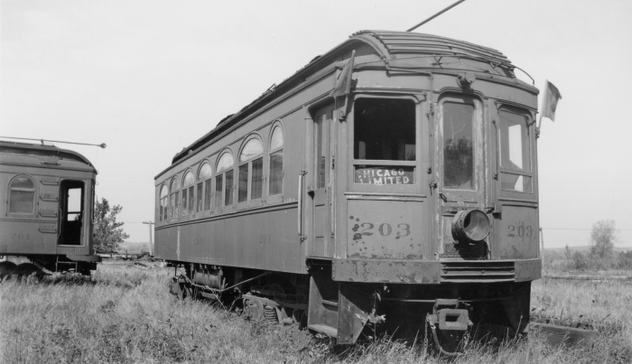 Elgin and Belvidere Electric car 203 sits abandoned in this 1930s photo. I think the photographer added the flags and the lantern to make the picture look better. (Photo by Ed Frank, Jr., Author's collection)