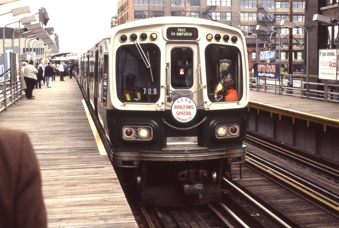 A newish 2000-series CTA "L" car leads the way on a mid-1960s fantrip. (Author's collection)
