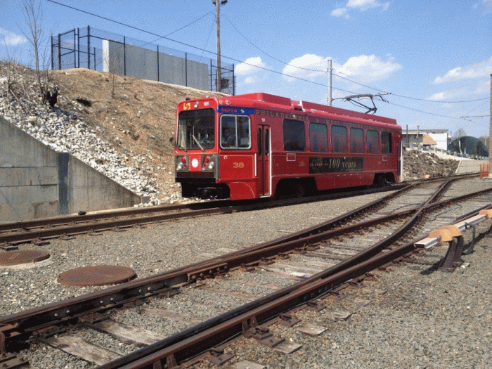 SEPTA LRV #101, done up with a special red overwrap to celebrate the 100th anniversary of trolley service to Media PA. (Photo by Bob Foley)