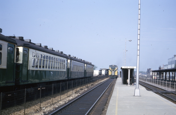 In this May 1964 shot, the C&NW bi-levels, running left-handed, are moving away from us, while a train of 4000s approaches the Harlem terminal on Lake. The outer portion of Lake was relocated to the embankment in 1962. The 4000s on this line would soon be replaced by new 2000s. (Author's collection)