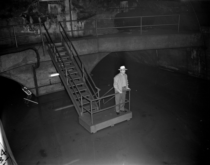 Virgil Gunlock, CTA chairman of the board, looks at the 12 feet of water in the subway at LaSalle and Congress on July 13, 1957. (Editor's collection)