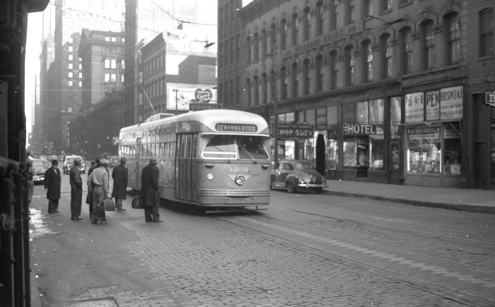 Frame 10 - "Postwar Pullman 4202 on Clark southbound approaching Van Buren. with the Federal Building and Old Post Office in the background." -GF