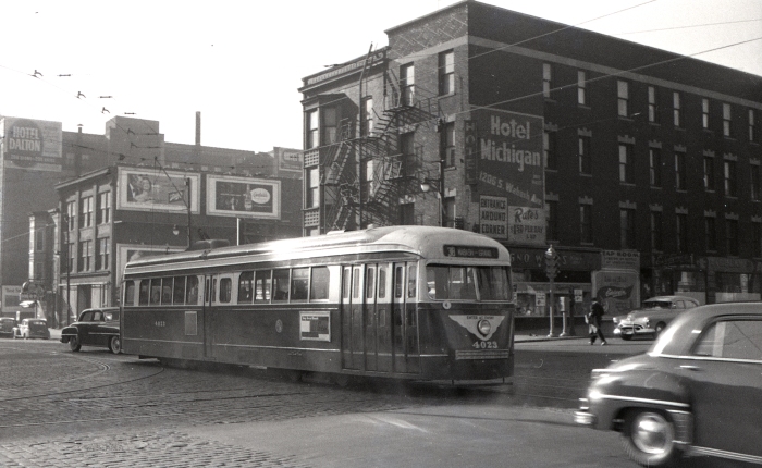 Frame 18 - Looking southwest from Wabash and Roosevelt. Prewar PCC 4023 is heading northbound. "Note #38 sign! This is an Indiana sign, but (the) car is obviously on 4-Cottage Grove. Apparently there was no 4 Wabash-Grand sign, but amazing that a PCC would have a sign for Indiana Ave., which could not use PCCs!" -AK