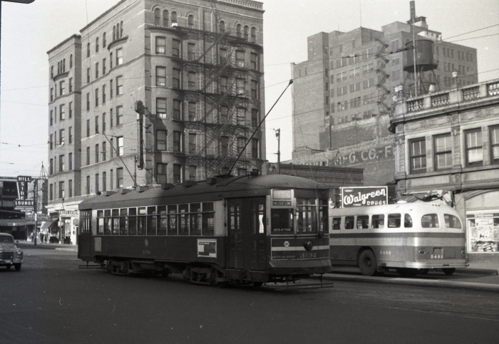 Frame 15 - "Red car 3132 on layover at Roosevelt and Wabash as a Roosevelt shuttle. View is looking northwest, with the Roosevelt North Shore Line terminal in the background... Hillside Lounge next to the station." -GF "Roosevelt Road Shuttle to Museum Loop on Route 12A." -JW