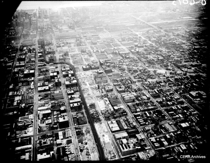 An aerial view (looking east) of the Garfield Park "L" and the future site of the Congress Super-Highway on September 2, 1950. If you look closely, you can see that some demolition has already taken place. The highway follows the path of the "L" in the foreground, heading straight through the middle of the old Main Post Office in the background.