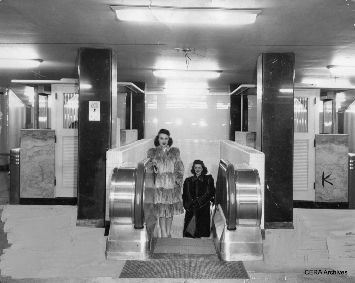 Models in furs pose in the uncompleted subway station at Clark and Division on March 18, 1943. Note the bare wires coming out of the ceiling.