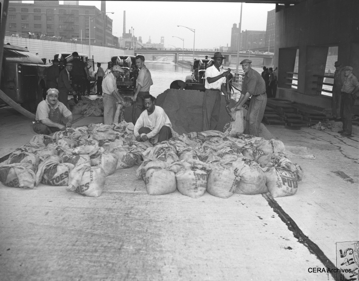 CTA sandbag crew, July 13, 1957. We enjoy having an opportunity to show the real working people of this country, whose contributions are often forgotten or taken for granted.
