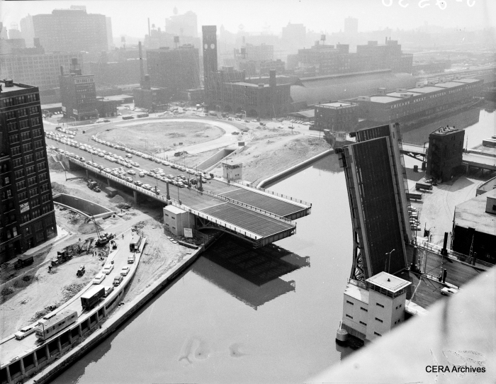 August 3, 1956: "Twin-bridge across the Chicago River which will open to traffic Aug. 10, when the Expwy. itself will be open to the public from Ashland Ave. to Michigan Ave. New type of device permits the bridgetenders to see clearly whether the bridge is fully closed or partly open even during the densest fog or on the darkest night." (Photographer unknown)