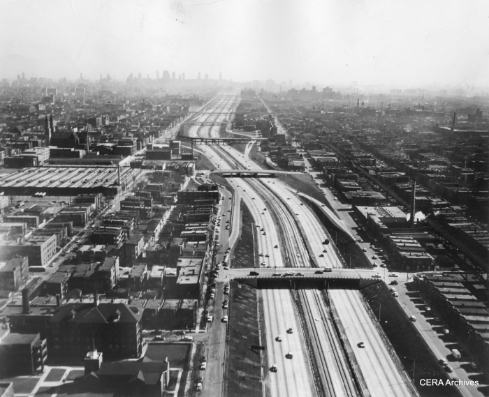 In this January 1958 view, we see both the unfinished Congress median line and the Garfield Park "L". Just above the middle of the photo, the "L" crosses from the north to the south of the expressway at Sacramento. Motorists apparently had to dodge support columns right in the middle of the highway. The "L" section at right continues west before crossing the highway yet again, while at left trains descend a ramp down to temporary trackage in Van Buren street. (Photographer unknown)