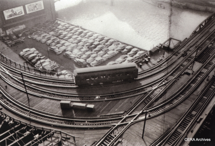 A lone Met "L" car heads toward the Loop in 1949. There were four tracks crossing the Chicago River at this point, on two parallel bridges. The tracks at the bottom of the picture led to the Wells St. terminal. In 1955, the tracks at left were torn out due to the construction of this part of Lower Wacker Drive, and a new connection to the Loop "L" was created by bridging the short gap with the gutted Wells St. Terminal. (Photo by Stanley Kubrick)