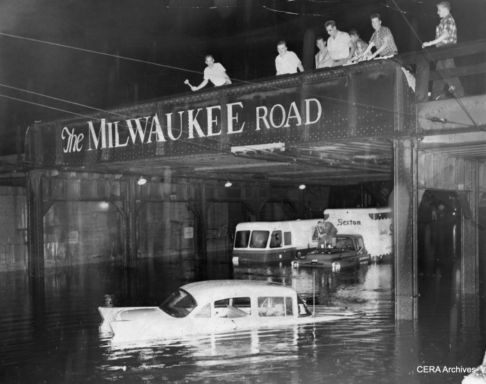 The CTA wasn't alone on July 13, 1957. Here motorists are stranded under the Milwaukee Road viaduct on Cicero avenue near Grand. (Photo by Pauer)