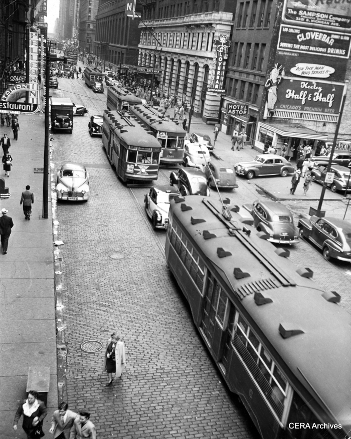Mystery Photo #11 - "Looking south onto Clark St. from the Clark & Lake "L" station. The Sedans are still serving Route 22 and my guess is the photo dates from the early 1940s." (Photographer unknown)