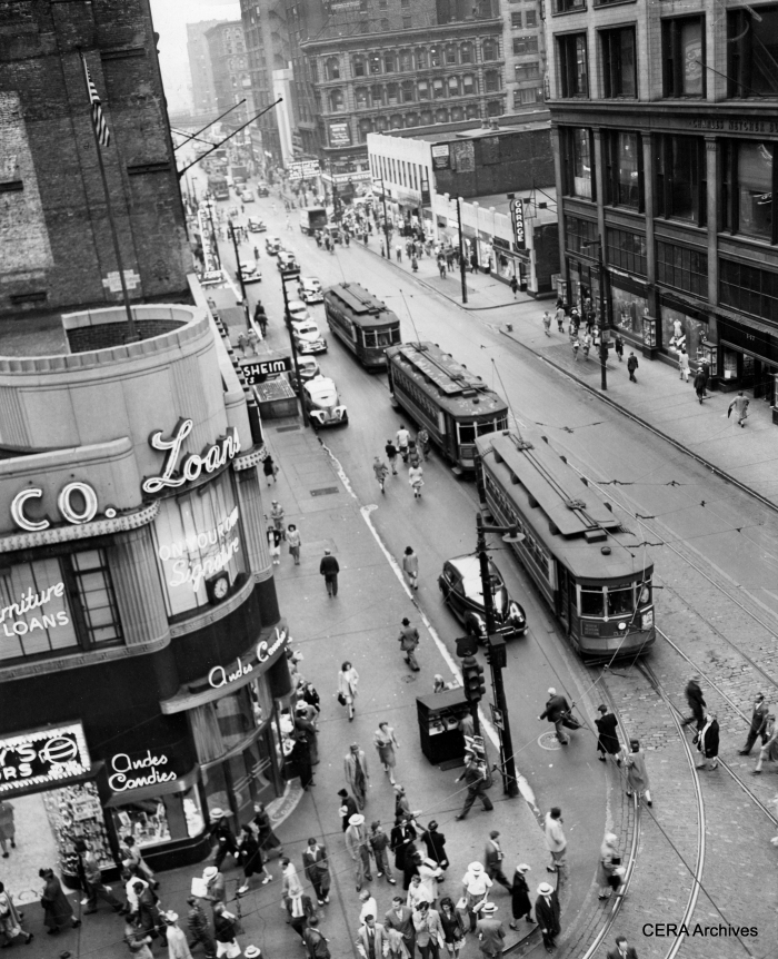 Mystery Photo #12 - "Milwaukee Ave. cars line up southbound on Dearborn ready to turn west onto Madison St. Note the "Charles Netcher Building" building to the right. Netcher was the founder of the Boston Store which remained in business at that site until 1948 (Sears now occupies the building). As the store fronts still look like the place is open, I'd say the photo was taken no later than 1948." (Photographer unknown)