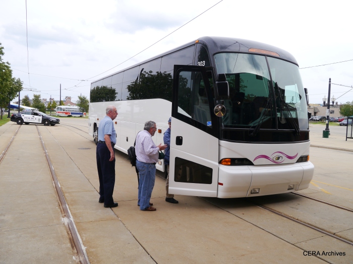 Fans board the CERA charter bus. (Photo by David Sadowski)
