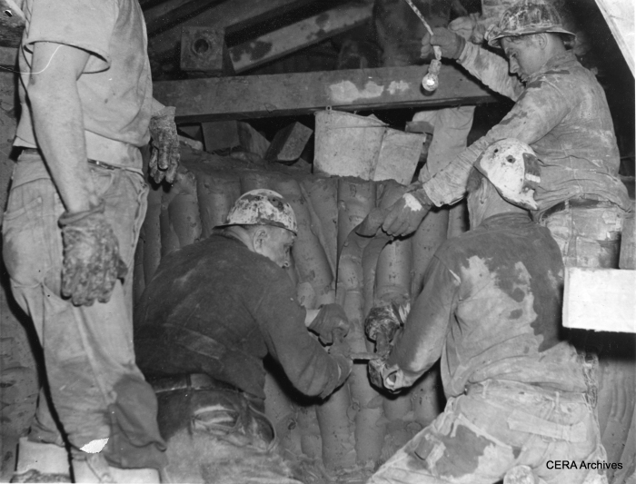 January 10, 1939 - "Because Chicago's subway is being dug at a depth of 35 feet, where there is clay instead of rock, it is being dug with knives. Curved blades about a foot long, with a handle at each end, are held by two men while a third one pushes the knife downward to slice off a long strip of clay. It was found that this is the fastest way to cut through clay. Three 'groundhogs' are shown above using one of the knives." (Photographer unknown)