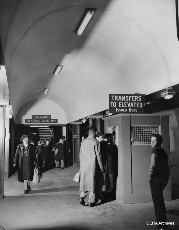 October 21, 1943 - "Transfers to allow passengers to switch from the subway trains to westside elevated cars running over the old structure comprising the Loop are issued issued from booths on the train-level platform. Built at two levels, the subway consists of a station level containing ticket seller, automatic turnstiles, checking lockers and washrooms, and the train level." Eventually, these booths were replaced by machines that issued "walking transfers." (Photographer unknown)