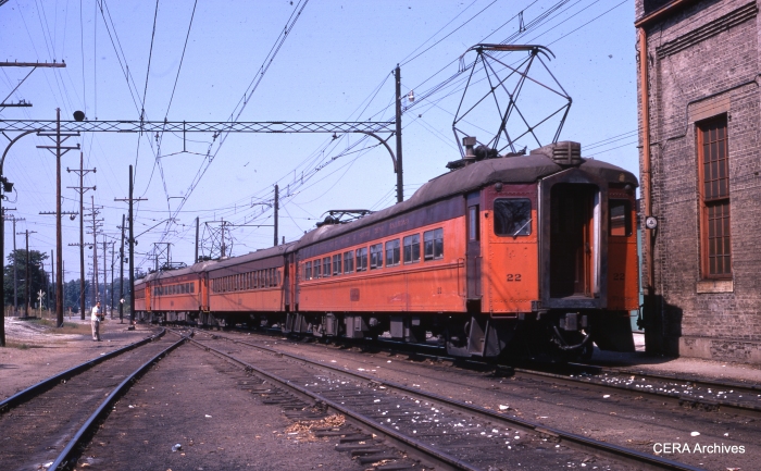 #22 heads up a four-car train in Michigan City in September 1969. (Photographer Unknown)