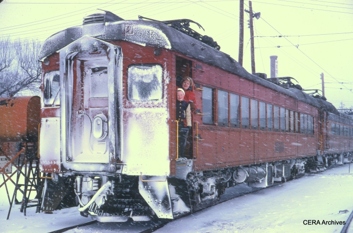 The caption reads, "Lance and Carol in snow-covered train, South Bend Yards, February 1969." (Photographer Unknown)