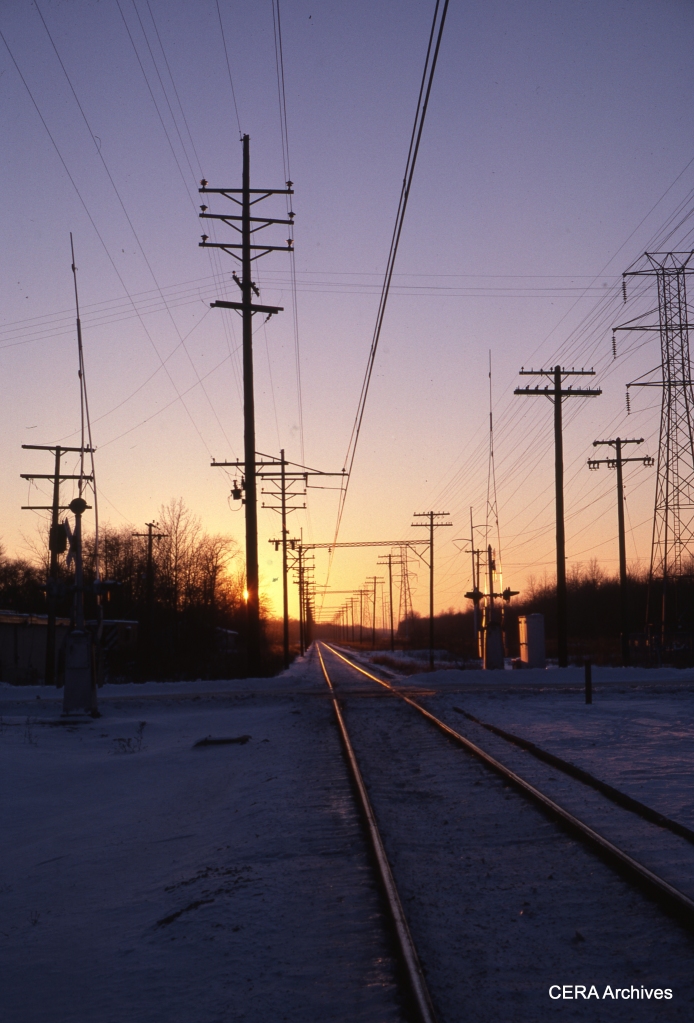 A twilight view of the single-rack right-of-way on January 3, 1978. (Photographer Unknown)
