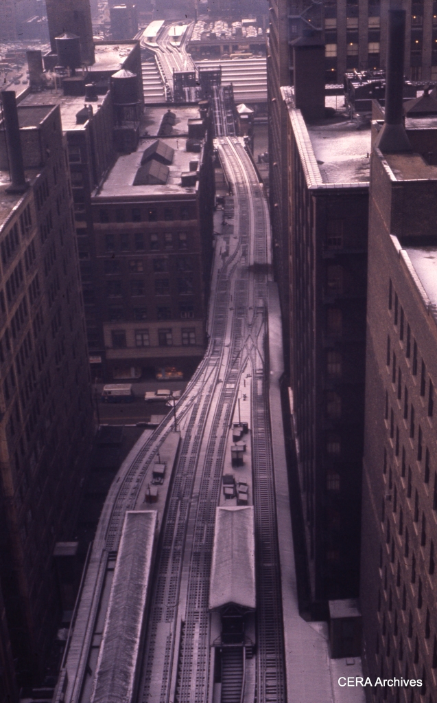 In this January 1960 view, we see the Garfield "L" structure heading west from the Loop, between the time service was discontinued (1958) and when the structure was torn down (1964). From the track arrangement, it would appear that one of the two bridges over the Chicago River was taken out of service sometime between the end of CA&E operation downtown (1953) and the rerouting of CTA service through the old Wells Street Terminal to a new connection with the Loop "L" structure. Other parts of the old Garfield "L" were torn down in 1959. (Photographer unknown)