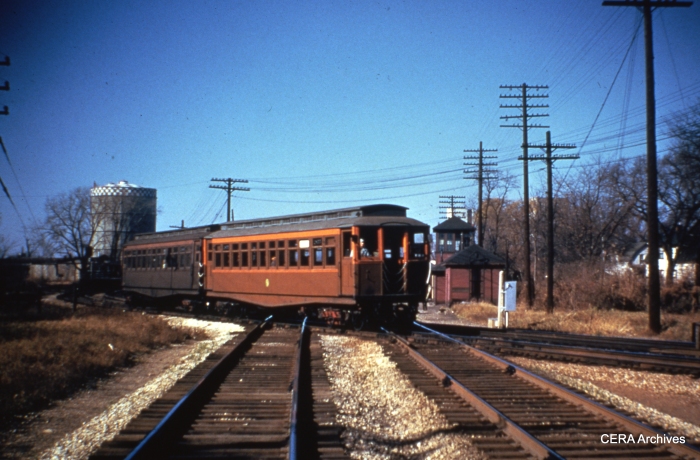 A train of CTA wood cars crosses the B&O just east of DesPlaines Avenue, at the current site of the Eisenhower expressway. (Photographer unknown)