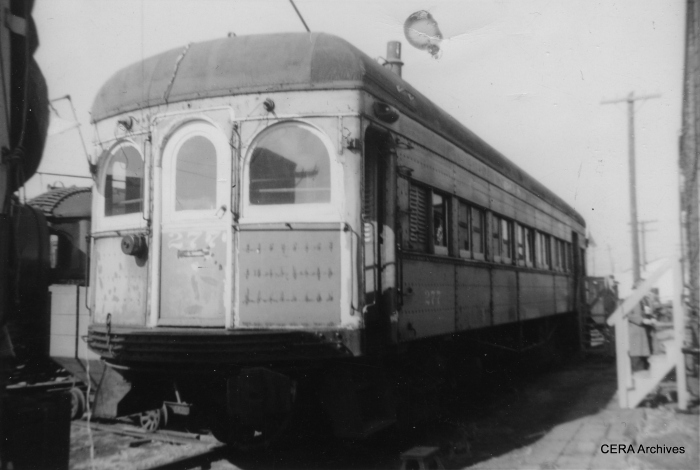 Don's Rail Photos reports that IT 277 "was built by St Louis Car in 1913, #966. It was rebuilt in October 1951 with new seats and other modernized features. It was sold to the Illinois Railway Museum on March 9, 1956." I believe this photo was taken in North Chicago, before IRM moved to Union. (Photographer unknown - CERA Archives)