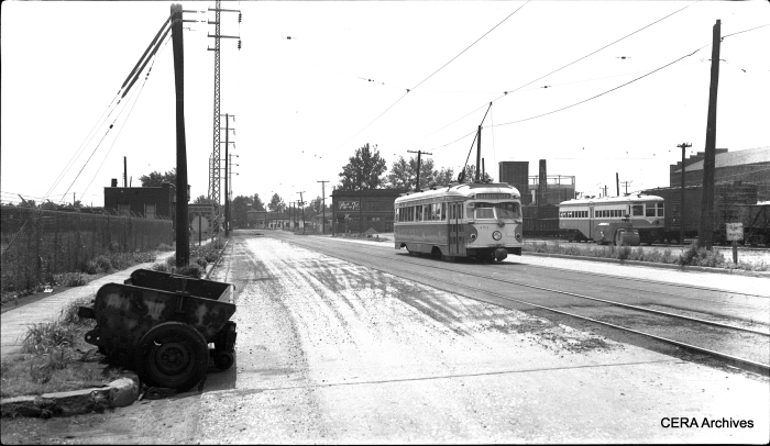 View looking south showing car #451 on Madison Avenue, just south of 17th Street in Granite City, Illinois, showing street resurfacing work, on June 3, 1956. Car 451 was built by the St. Louis Car Co. in 1949 and is now preserved at the Connecticut Trolley Museum. (Photographer unknown - CERA Archives)