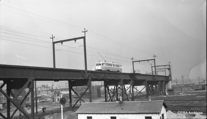 View looking northeast from Hall street, showing a PCC car on the elevated structure parallel to North Market Street east of Hall Street in St. Louis in 1954. (Photographer unknown - CERA Archives)
