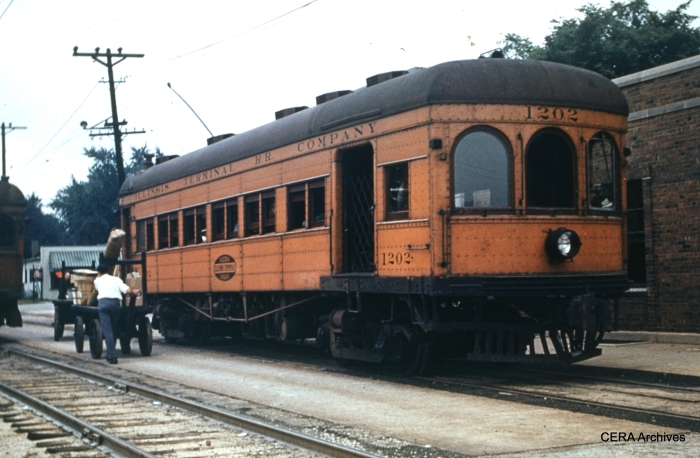IT 1202 in 1949. According to Don's Rail Photos, "1202 was built by McGuire-Cummings in 1910 as an express motor with 20 seats at the rear. In 1919 it was rebuilt with a small baggage section at the front and the trucks were changed from Curtis to Baldwin. It was renumbered 202 on December 28, 1953, and sold for scrap in 1956." (Photographer unknown - CERA Archives)