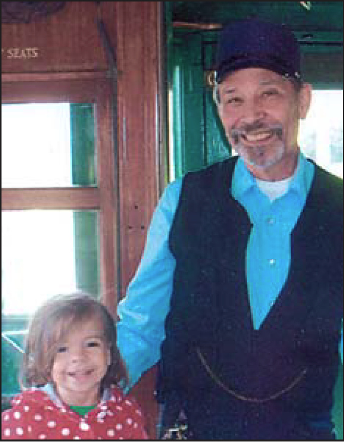 John Marton with one of his beloved grandchildren, in a picture he chose to include in last year's CERA publication Trolley Sparks Special #1.