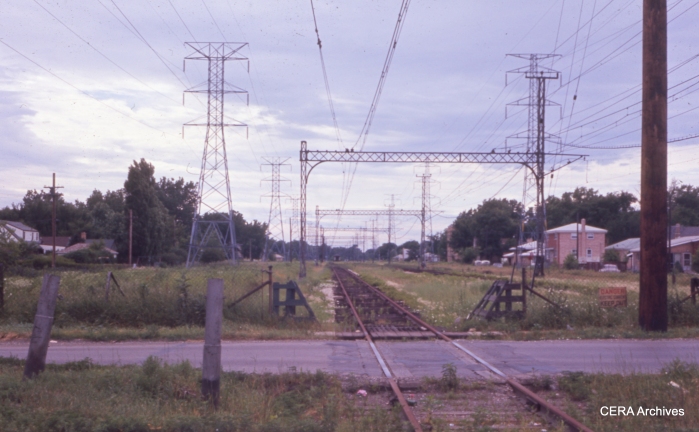 The derelict North Shore right-of-way at Crawford Avenue in July 1963. The wire is up, but the rails are rusty after not having been used in several months. (CERA Archives)