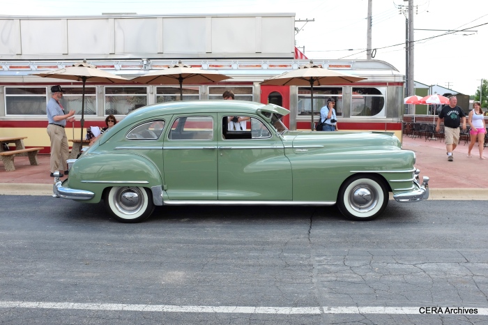 A side view of the 1948 Chrysler parked in front of the IRM Diner.