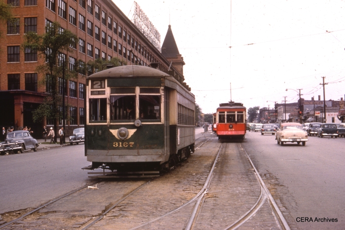 CTA 3167, the regular service car, prepares to go out ahead of 473 and 479, the fantrip cars, in this May 16, 1954 scene at the west end of the route 21 Cermak line. The famous Western Electric plant is at left. These cars looked much better in CSL red than they did in CTA green.