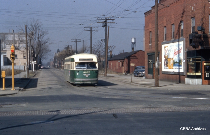 At the south end of the long 36-Broadway-State line, Pullman-built PCC 4067 prepares to make the turn at 120th and Halsted on March 21, 1954. Tracks of the former Chicago and Interurban Traction Company are in the foreground.