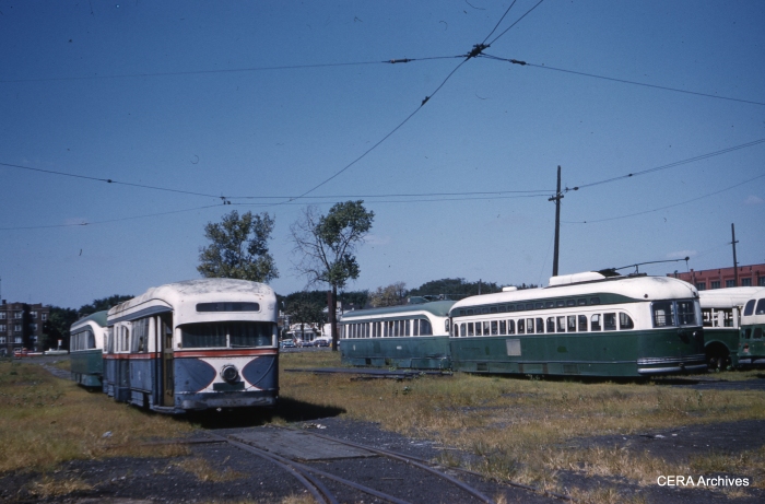 It's September 10, 1959, and there has been no Chicago streetcar service for more than a year, yet a few forlorn cars remain on the property at South Shops. Visible are cars 7001 (the experimental 1934 Brill pre-PCC), a post-war car, 4021, and at least one additional prewar car. (Clark Frazier Photo - CERA Archives)
