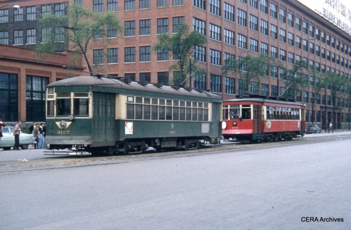 479, at Cermak and Kenton, lets the regular service car go out ahead of it. The Western Electric plant is in the background. (CERA Archives)