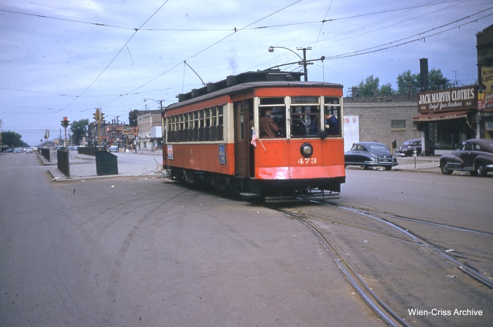 The 473 at Cermak and Kenton, the end of Route 21. Just a few years earlier, passengers would transfer from Chicago Surface Lines streetcars to those of the Chicago & West Towns Railways. Since the abandonment of West Towns trolley service in 1948, the area behind the red Pullman has been paved as a bus loading/unloading area. (Bill Hoffman Photo - Wien-Criss Archive)