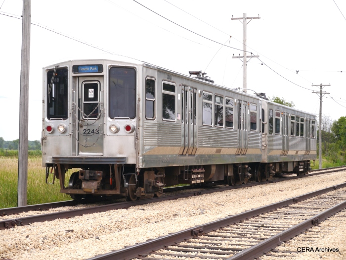 CTA 2243-2244, now fitted with trolley poles, approaching Olson Road. (David Sadowski Photo)