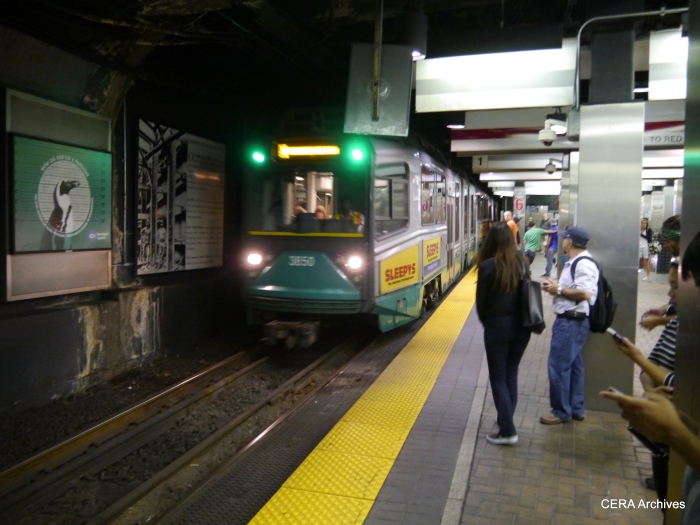 A train prepares to stop in the Green Line subway.