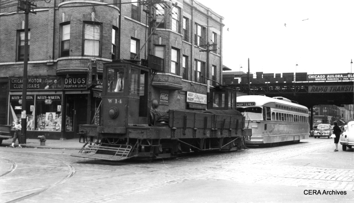 CSL W14 towing a PCC northbound at Kedzie and Harrison in 1947. As you can see by the sign, Chicago, Aurora & Elgin trains stopped at the Kedzie "L" station on the Garfield Park line. (Joe L. Diaz photo, CERA Archives)