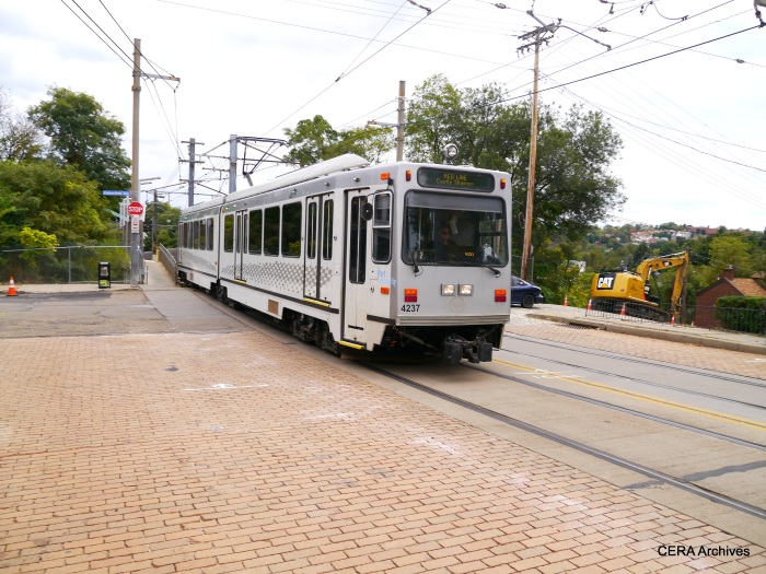 Outbound PAT 4237 leaves the Fallowfield station and enters a mile or so of street trackage along Broadway in the Beechview neighborhood (October 5, 2014).